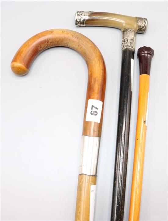 Two silver mounted walking sticks and another